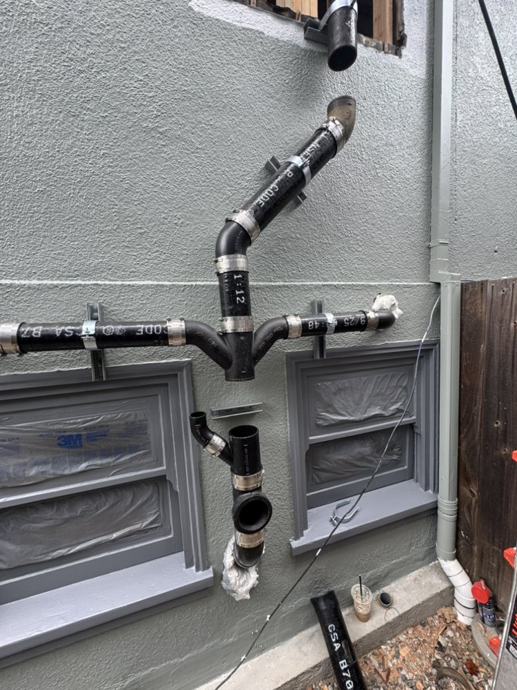 New ABS drain, waste and vent stack installed on a Yuma, AZ home exterior
